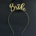 Macro view of gold Bride headband featuring diamond accent on the letter i - No Rhinestones / Gold
