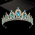 Detail of gold tiara featuring blue teardrop rhinestones and sparkling crystals - Hg-056 Gold + Lake Blue