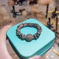 Detail of leopard print hair scrunchie with sparkling crystal ball on jewelry box - Leopard Print (TS015)