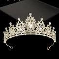 Detailed close-up of golden bridal crown with sparkling rhinestones and drop-shaped crystal - Gold With White Rhinestone