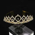 Macro detail of golden crystal crown with white rhinestones and side combs on black background - Gold (HG-091)