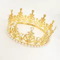 Detailed close-up of golden metal cake crown with white pearls and sparkling rhinestones - Hollow Pearl Crown / Gold