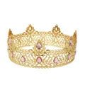 Macro shot of gold vintage crown showing pink gemstone inlays and baroque filigree - Gold Pink