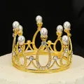 Elegant gold mini crown featuring white pearls and rhinestones on a round platform - Gold + White Pearl