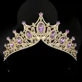 Macro detail of royal crystal tiara with purple gemstones and golden frame - Purple