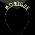 Close-up of MOM TO BE gold tiara with sparkling rhinestones for baby shower parties - Gold