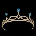 Detailed view of luxury gold crown with blue teardrop rhinestones and pavé crystals - Gold + Lake Blue