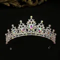 Elegant silver tiara with colorful AB rhinestones and pear-shaped crystals on black background - Gold with AB Rhinestone