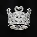 Detailed macro view of a silver crown cake topper ring with heart and crystal accents - Silver