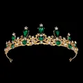 Golden bridal crown with emerald rhinestones in vintage European style on black background - Gold Green