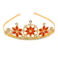Detail view of golden crown with red marquise rhinestones and white snowflake accents - Snowflake Rhinestone Tiara / Gold + Red (HG-243)