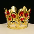 Elegant golden crown cake topper with red teardrop rhinestones and floral design - Gold+Red