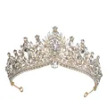Detailed macro shot of baroque gold crown with sparkling rhinestones and crystal stones - Gold+White