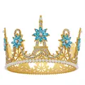 Detailed close-up of golden bridal tiara with pearls, blue gems and Eiffel Tower motif - Gold + Lake Blue