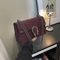 Burgundy leopard print crossbody bag with silver tiger head buckle and chain strap - Red