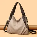 Detail view of large two-tone beige and brown tote bag with premium lychee grain PU leather - Khaki