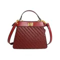 Retro wine red top handle bag with woven texture and gold twist lock in trapezoidal shape - Red