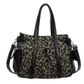 Leopard print canvas tote bag with black faux leather trim and silver hardware main view - Black