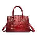 Deep red crocodile pattern handbag for women with shiny leather finish and gold hardware - Red