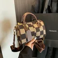 Brown checkered canvas Boston bag with leather handles and wide fabric shoulder strap - Checkered Brown