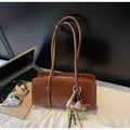 Brown oil wax leather tote bag with bear charm detail and extended shoulder strap - Without Pendant / Yellow Brown