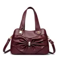 Elegant wine red leather handbag with large bow accent and rhinestone detail - Burgundy