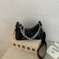 Chic black PU leather crescent underarm bag with bold silver metal chain detail - Black