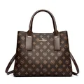 Brown monogram tote bag with leather texture, large capacity, and gold brand logo detail - Brown