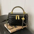 Elegant black beaded box bag with gold metal handle and woven chain crossbody strap - Black
