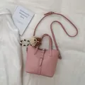 Pink lychee texture bucket bag with cute bear charm and adjustable shoulder strap - With Pendant / Pink