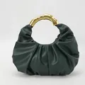 Dark green pleated cloud bag with golden metal handle and fine leather texture - Green