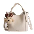 Cream white lychee leather bucket bag with teddy bear charm and adjustable strap - With Bear Charm / White