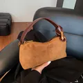 Brown suede pillow handbag with knotted leather handle and gold-tone hardware detail - Suede Brown Without Pendant