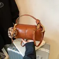 Vintage brown leather boston bag with leopard print charm on a silver suitcase - Brown with Pendant