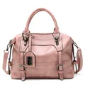 Pale pink lychee texture Boston bag with decorative straps and top handle for women - Pink