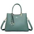 Green leather handbag with litchi texture and gold heart pendant decoration - Green