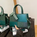 Dark green patchwork handbag with crocodile texture and adjustable shoulder strap - Green