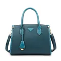Peacock blue handbag set in pebble leather with crocodile pattern details and gold hardware - Tote Bag Style / Blue