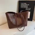 Deep brown large capacity tote bag with litchi grain leather texture and long shoulder strap - Brown / One Size