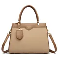Brown and beige canvas paneled tote bag with dual handles and gold-tone hardware detail - Khaki