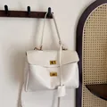 Elegant cream leather tote bag featuring dual gold twist locks and a minimalist design - Large / White