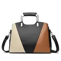 Chic tri-color leather handbag in beige, black and caramel with silver U-shaped metal handle - Black
