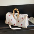 Sac de voyage en toile crème avec broderie cerise et poignées en cuir jaune - Blanc Cassé