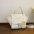 Chic beige crossbody bag with croc-embossed wings and elegant gold-tone metal clasp - Off White