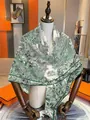 Detail view of large cashmere blend botanical garden print shawl on a wooden mannequin - 130x130cm / Green Botanical Garden