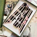 Elegant geometric stripe silk-like twilly scarf with pink bow print on a green gift box - Bowknot Geometric Style / Black