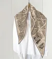 Close-up of vintage map print on a beige silk scarf tied around a white shirt collar - 45x115cm / Paris Map Beige (24)