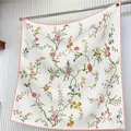 Detail of floral silk scarf showing elegant botanical prints and pink hemmed edges - Fresh Floral / Large Square