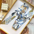 Blue bird print twilly scarf with floral patterns in an orange luxury gift box - Blue