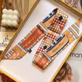 Slim silk-like scarf with orange geometric patterns in a luxury gift box - Ginger Yellow